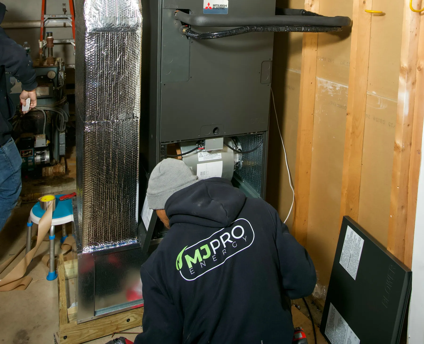Technician inspecting a home heating system
