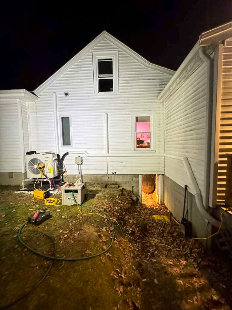 MJ Pro tech doing an emergency heat pump service at night