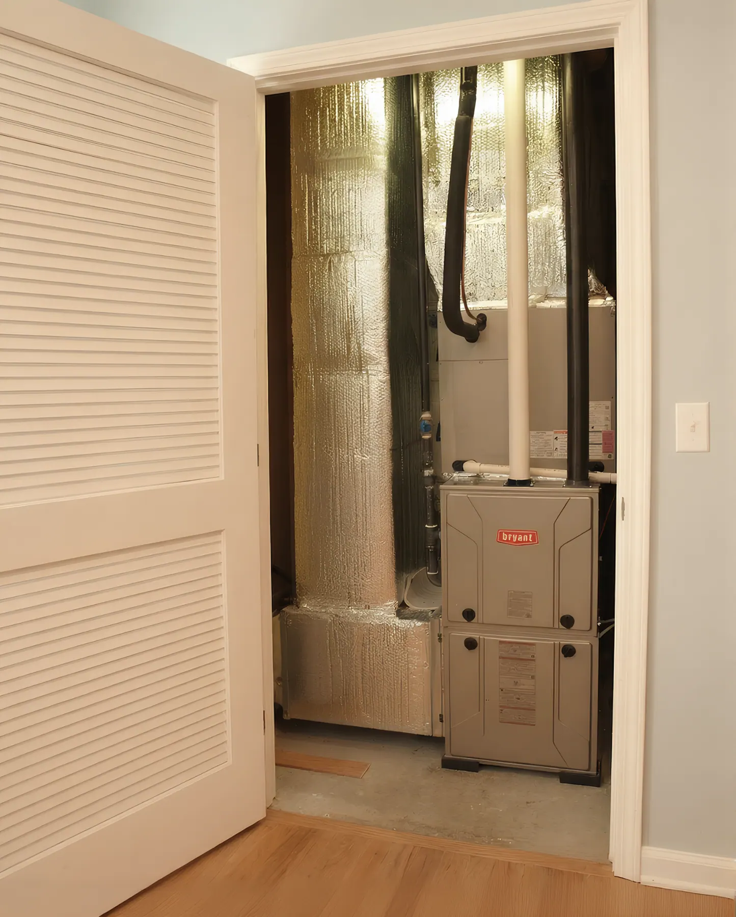 New Bryant furnace installed in a clean basement closet