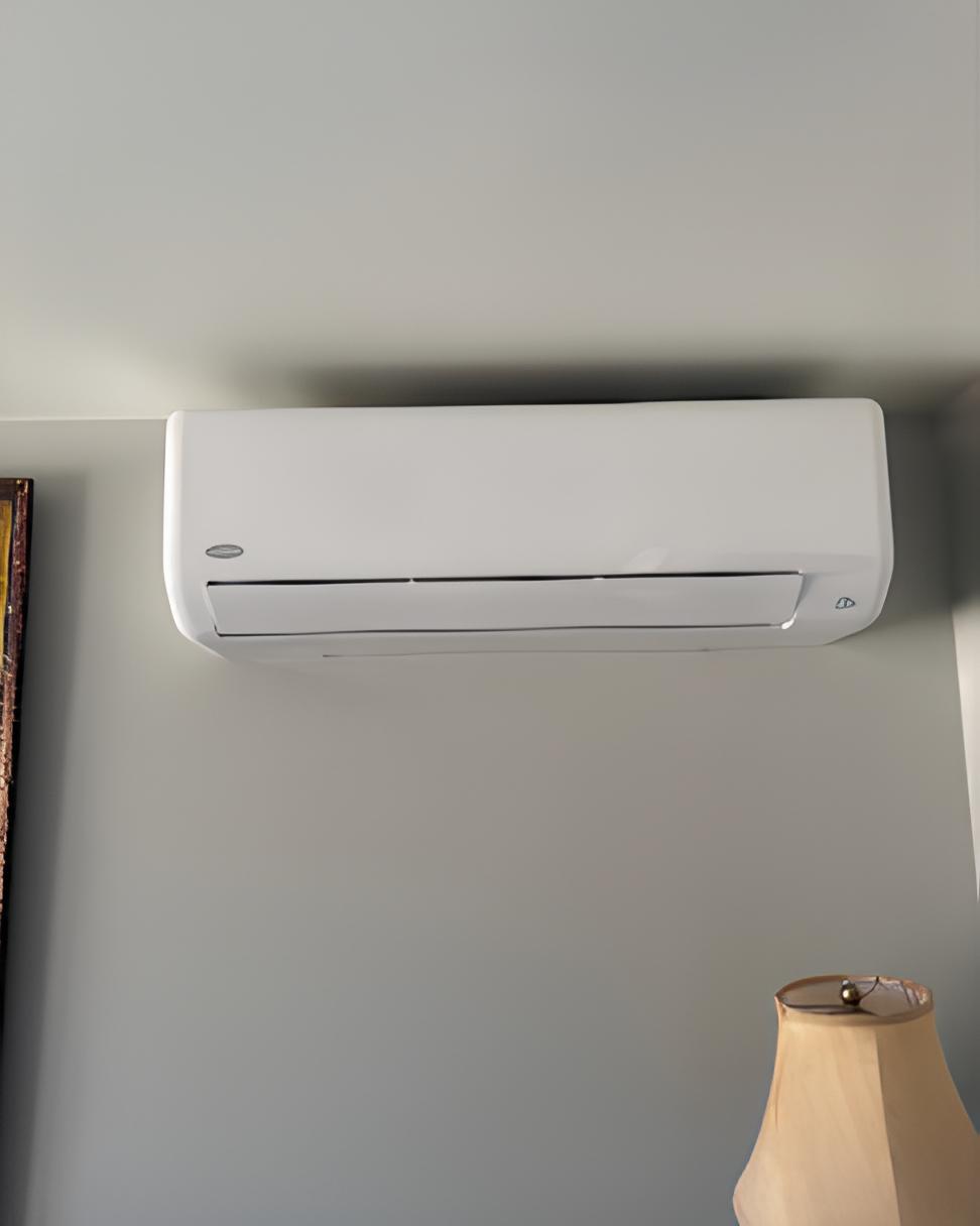 Wall-mounted ductless mini split head in a living room