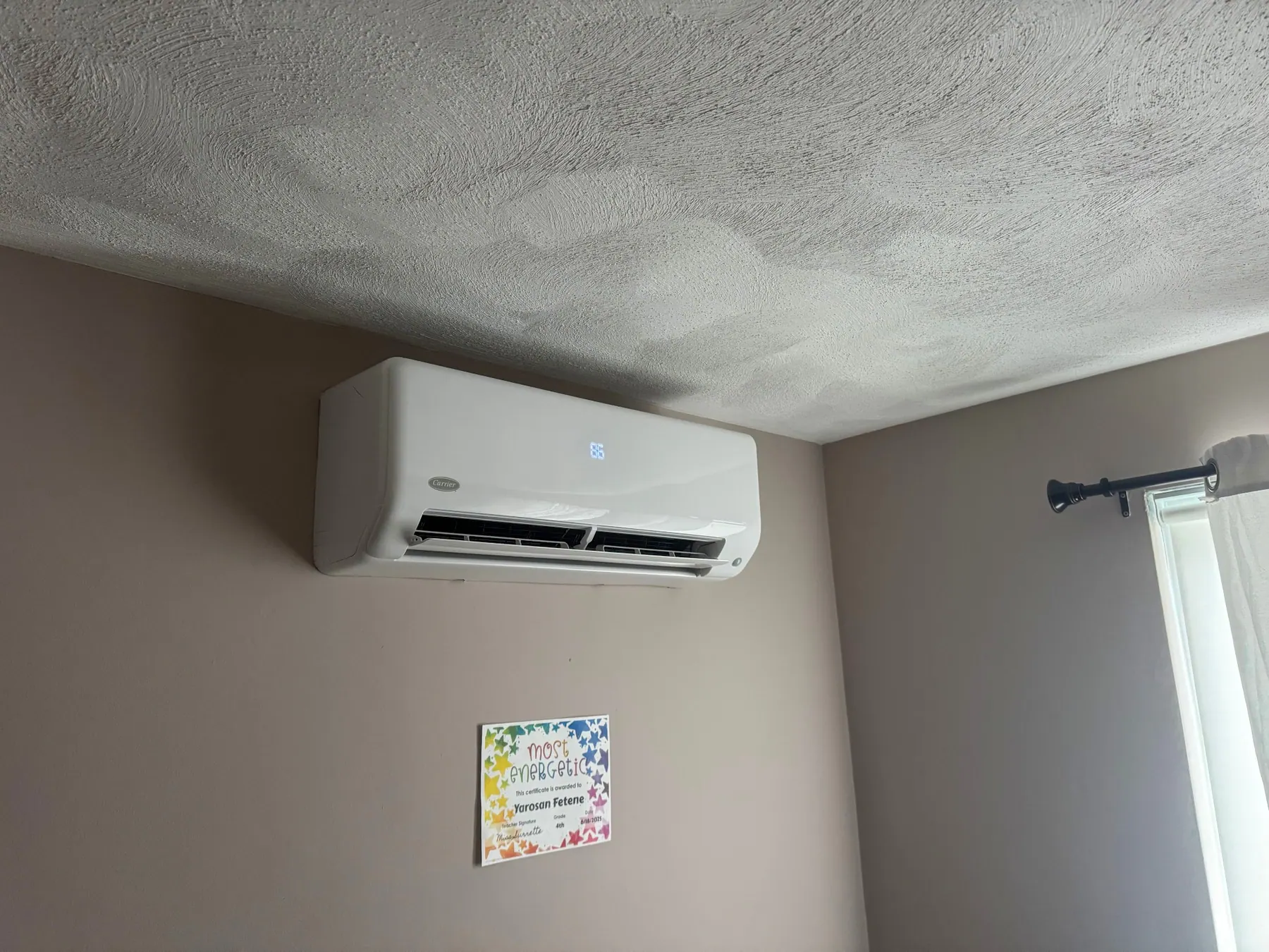 Ductless mini split head mounted on a wall
